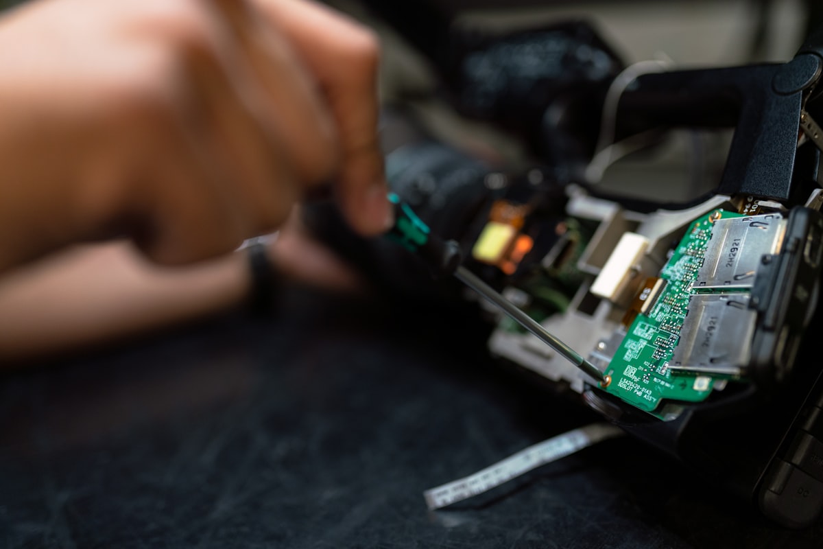 Technician repairing electronic equipment